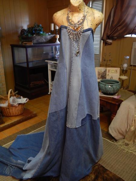 20203 Michael J Bleached Denim Dress has a train and a zipper in the back. It is made from pre-loved jeans. To order specify bust, waist, and hip measurements. A length measurement will also be needed.